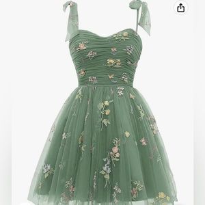 Beautiful floral dress in a sage green size 10 but has corset to adjust